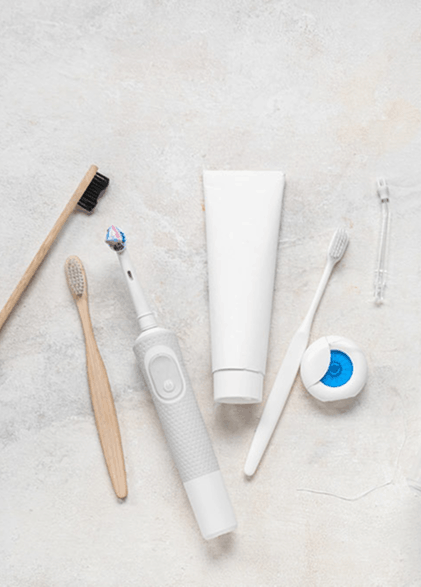 A photo of tooth brushes and tooth paste.